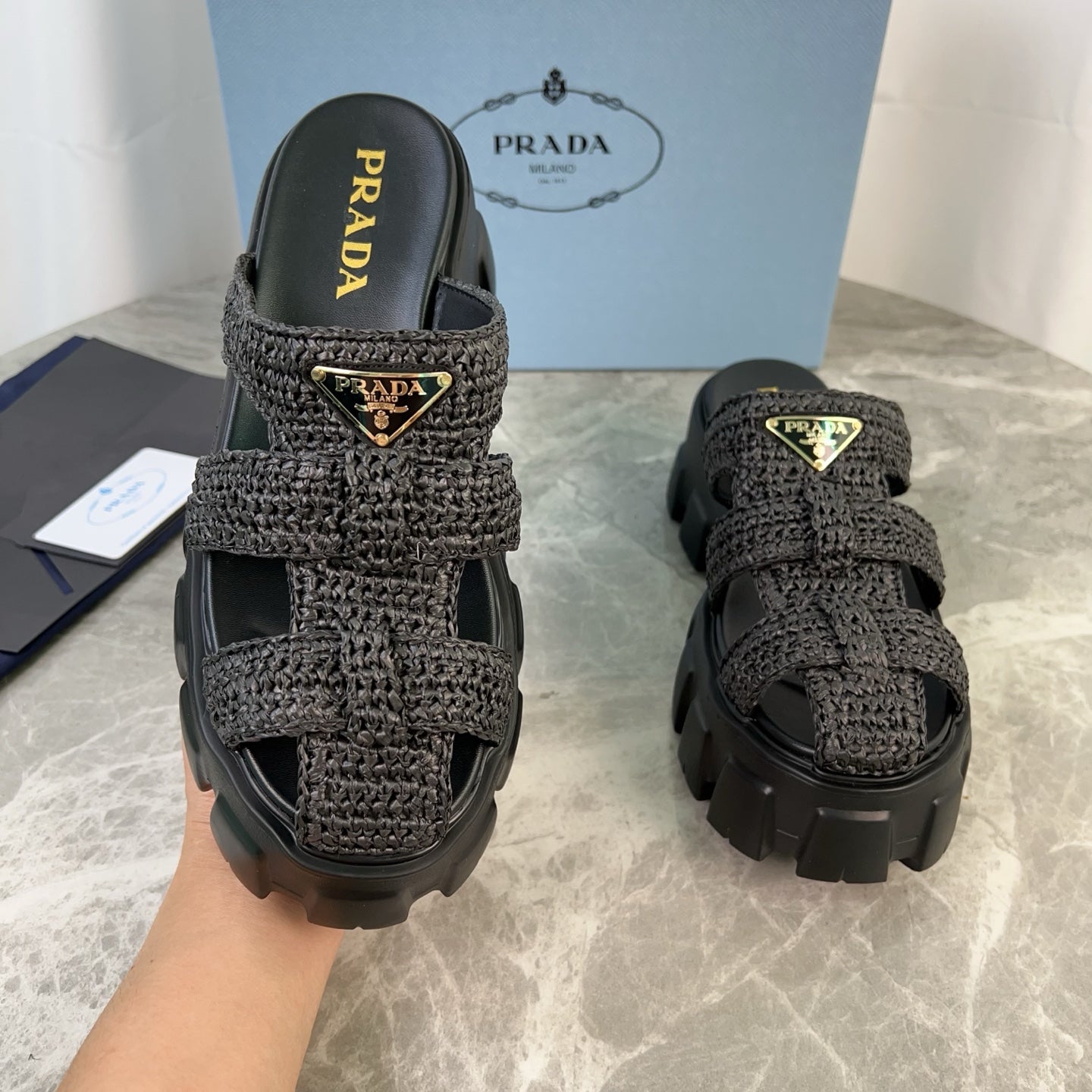 PRADA 25S MONOLITH RUBBER MULES IN BLACK RAFFIA AND LAMBSKIN