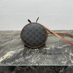 CLARA BAG 19 IN BLACK TRIOMPHE CANVAS AND BROWN CALFSKIN TRIM
