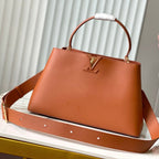 CAPUCINES GM 38CM BROWN ORANGE TAURILLON LEATHER