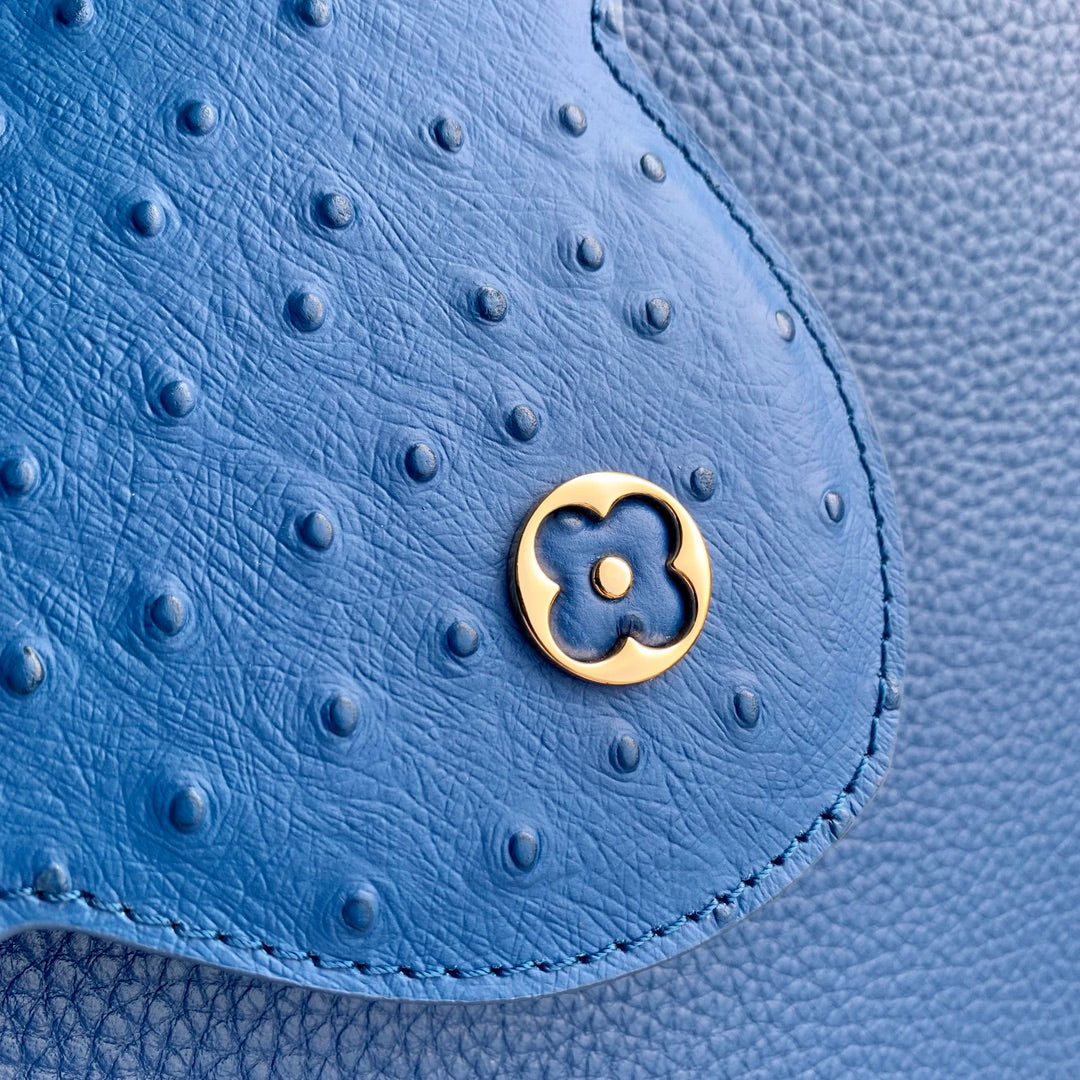 capucines mm 31.5 cobalt blue taurillon leather gold hardware
