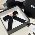 BOW HAIR CLIP IN BLACK MIX BEIGE FABRIC 406108