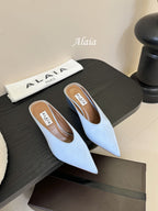 ALAIA HIGH MULES 25S IN LIGHT BLUE SATIN