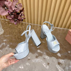 PLATFORM HEELS IN BABY BLUE PATENT CALFSKIN GOLD LOGO IN STRAP