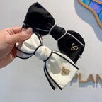 BOW HAIRPIN IN BLACK AND WHITE TRIM COTTON 406022