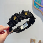 BLACK FABRIC WITH GOLD LOGO HAIRBAND 415931