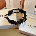 BLACK FABRIC WITH GOLD LOGO HAIRBAND 415931