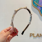 HEADBAND GOLD LOGO IN BEIGE SILK 417302