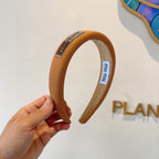 THICK HEADBAND IN BRONZE ORANGE DIAGONAL LEATHER 425479