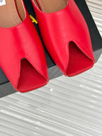 ALAIA FLAT MULE IN CRIMSON RED LAMBSKIN
