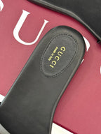 SLIDE SANDALS IN BLACK CALFSKIN WITH GOLD HARDWARE