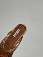 ALAIA FLAT MULES IN COPPER BROWN MESH FISHNET