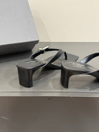 BALENCIAGA 25S HIGH-HEELED FLIP-FLOPS IN BLACK CALFSKIN WITH SILVER HARDWARE