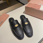 MULES SLIPPERS BLACK COWHIDE WITH GOLD COIN