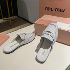 MULES SLIPPERS WHITE COWHIDE WITH GOLD COIN
