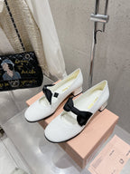 MARY JANE MID HEEL PUMPS IN WHITE PATENT LAMBSKIN WITH BOW