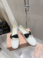 MARY JANE MID HEEL PUMPS IN WHITE PATENT LAMBSKIN WITH BOW