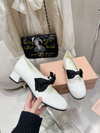 MARY JANE MID HEEL PUMPS IN WHITE PATENT LAMBSKIN WITH BOW
