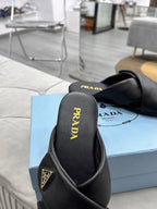 PRADA 25S SLIDE SANDALS IN BLACK CALFSKIN LOGO