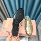 MULES SLIPPERS METALLIC GOLD COWHIDE WITH GOLD COIN