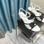 SANDALS IN WHITE SHEEPSKIN WITH BLACK SATIN BOW
