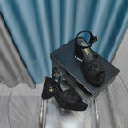 THICK-SOLED WEDGE SANDALS IN BLACK SUEDE
