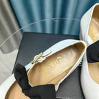 HIGH MARY JANE SHOES WHITE SHEEPSKIN WITH BLACK BOW