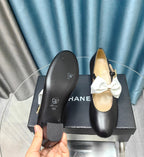 HIGH MARY JANE SHOES BLACK SHEEPSKIN WITH WHITE BOW