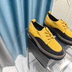 OXFORD SHOES IN GOLD YELLOW SUEDE AND BLACK SHEEPSKIN