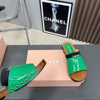 SLIPPERS IN GREEN GLOSSY CALFSKIN WITH BLACK HALF-FOOT SOCKS