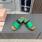 SLIPPERS IN GREEN GLOSSY CALFSKIN WITH BLACK HALF-FOOT SOCKS