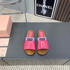 SLIPPERS IN PINK GLOSSY CALFSKIN WITH PURPLE HALF-FOOT SOCKS