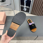 SLIPPERS IN BLACK SUEDE WITH PURPLE HALF-FOOT SOCKS