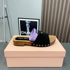 SLIPPERS IN BLACK SUEDE WITH PURPLE HALF-FOOT SOCKS