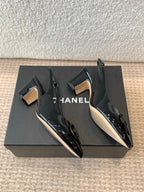 MID-HEEL SLINGBACKS IN BLACK PATENT CALFSKIN