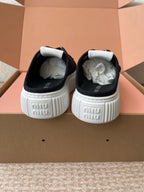WASH SNEAKER MULES IN BLACK DENIM