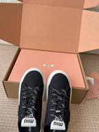 WASH SNEAKER MULES IN BLACK DENIM