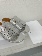 ALAIA VIENNE FLAT MULES IN SILVER LAMBSKIN