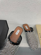 ALAIA FLAT MULES IN STRASS BLACK LAMBSKIN WITH RHINSTONES