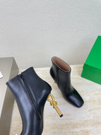KNOT ANKLE BOOT IN BLACK CALFSKIN WITH GOLD METAL HEEL 9 CM