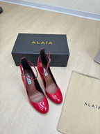 DECOLLETE PUMPS IN CHERRY RED PATENT CALFSKIN