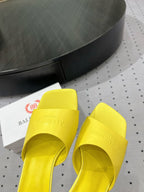 SQUARE-TOE MEDIUM HEEL MULES IN YELLOW CALFSKIN LOGO EMBOSSED