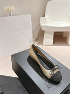 BALLET FLATS IN GOLDEN GLITTERED TULLE AND BLACK SATIN
