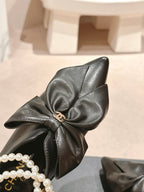 SHORT BOOTS IN BLACK SHEEPSKIN WITH BOW