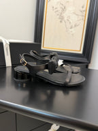 FLAT SANDALS IN BLACK CALFSKIN WITH BOW