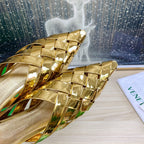 ALFIE LEATHER FLAT MULES IN GOLD PATENT CALFSKIN WITH WOVEN DESIGN