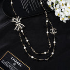 CHANEL 25S CHAIN BELT IN BLACK AND WHITE PEARL 614285