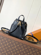 LV Coussin 20cm Backpack Black Gold Leather 252655