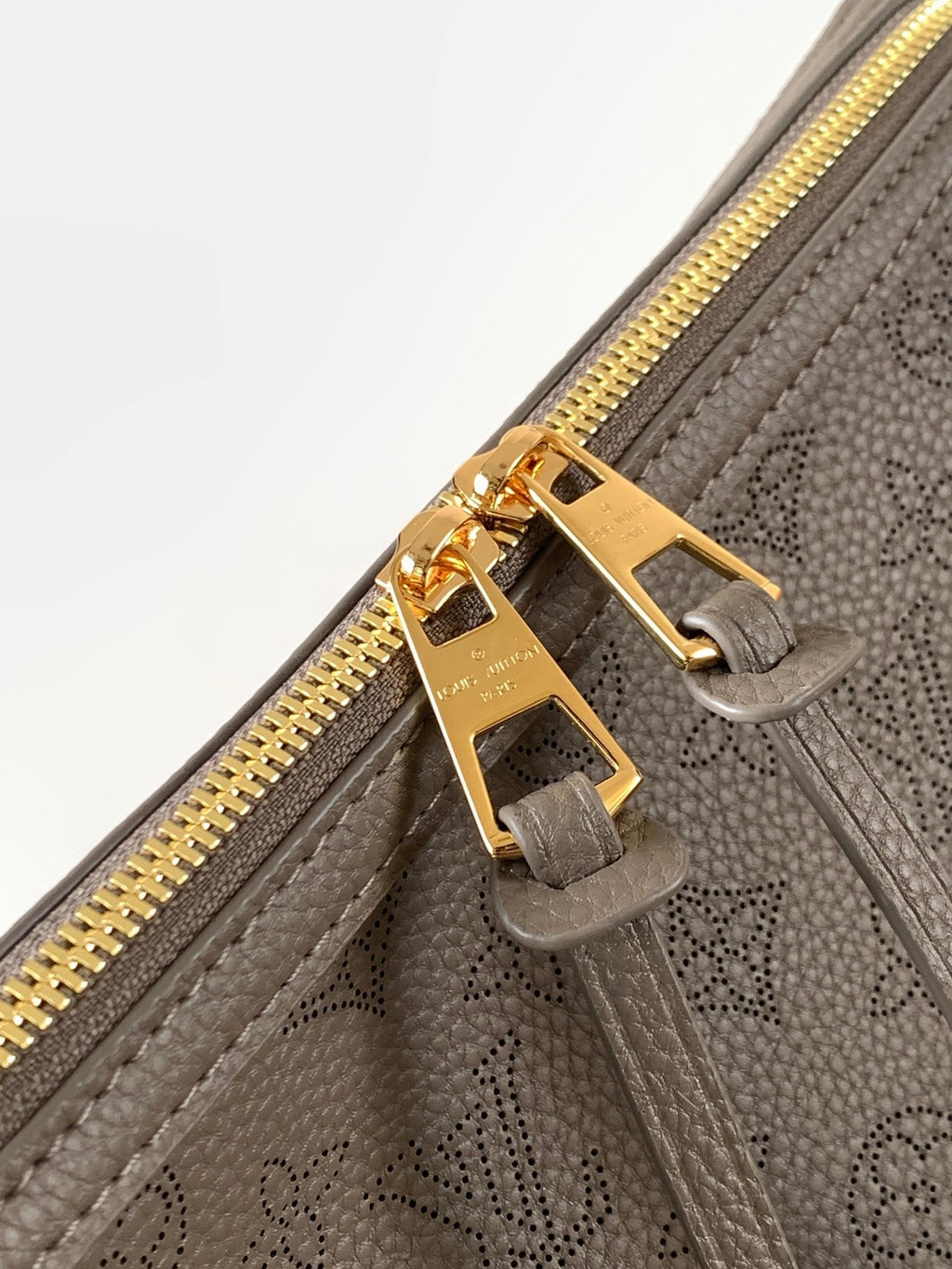 LV M25904 Hand It All PM Taupe Perforated Mahina Calfskin