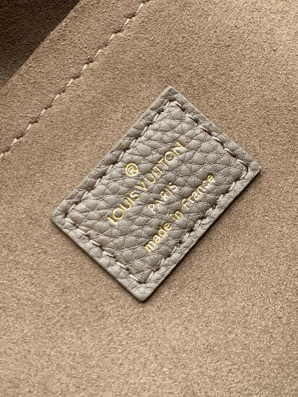 LV M25904 Hand It All PM Taupe Perforated Mahina Calfskin