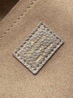 LV M25904 Hand It All PM Taupe Perforated Mahina Calfskin